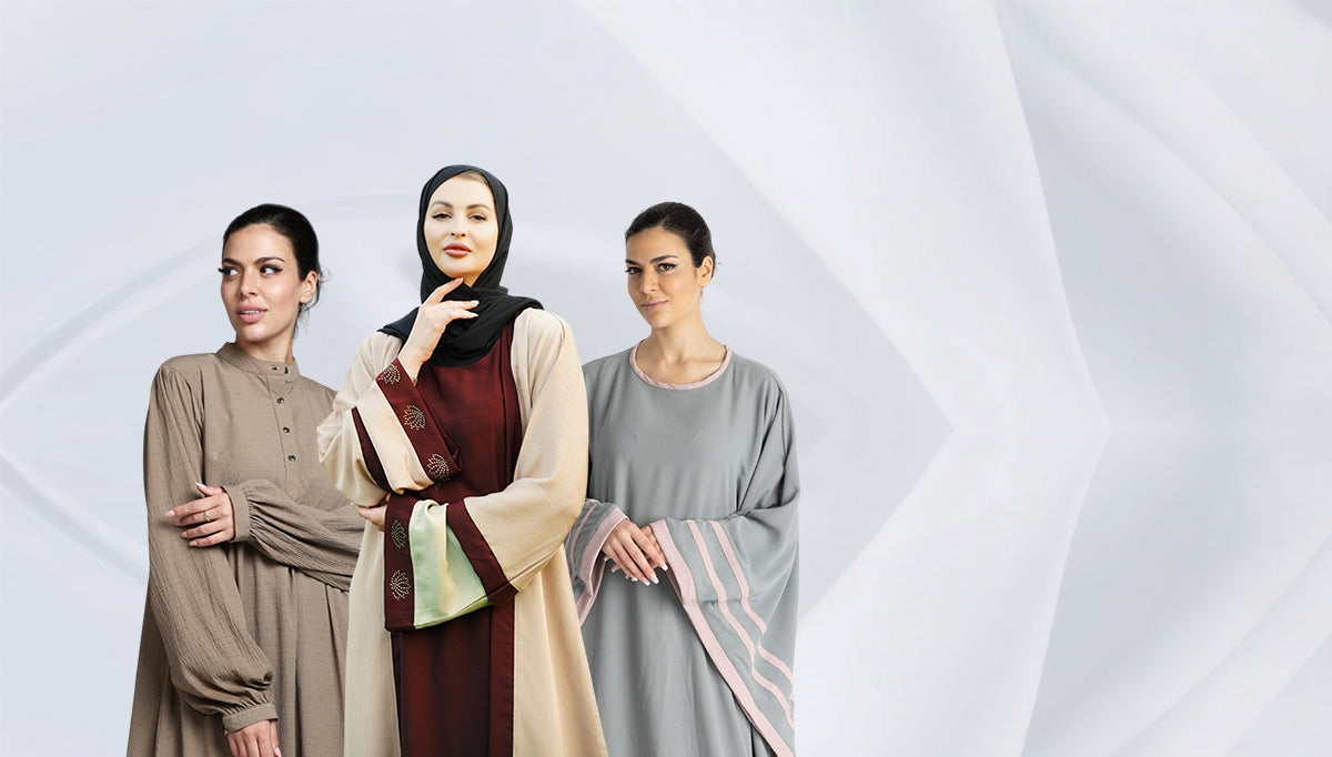 Three women wearing hijabs and abayas on a light gray background